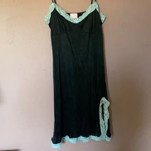 Black slip dress with blue lace trim and side slit